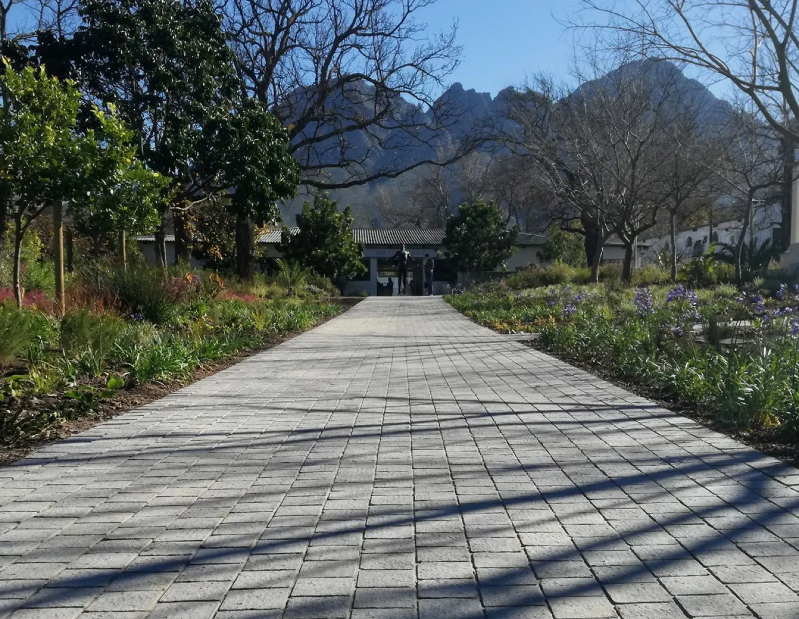 A CAPECAST paved walkway leading to a Cape estate beneath the mountains